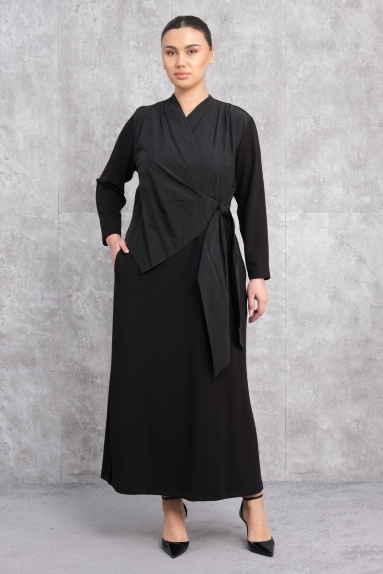 This elegant black dress is a perfect choice for those seeking feminine elegance. Available in sizes S, M, L, and XL. The fabric content is 90% polyester and 10% elastane, providing comfort and flexibility. From the front, the knotted design detail adds a touch of sophistication, while the long sleeves make it a suitable option for cooler weather. The back view of the dress offers a simple and chic look.