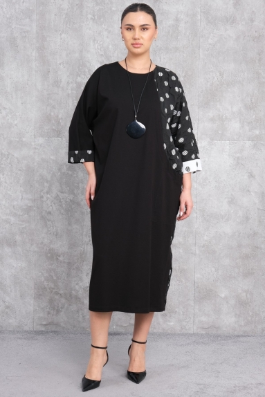  This elegant black polka dot dress is designed to add sophistication to womens wardrobes. Made from 94% polyester and 6% lycra, it provides both comfort and flexibility. The dress is available in sizes S, M, and L. The pattern section features delicate white polka dots, while the body part is a plain black color. As seen on the model, the dress extends to the knees, and the sleeves slightly widen towards the wrists. It is ideal for both day and night elegance.