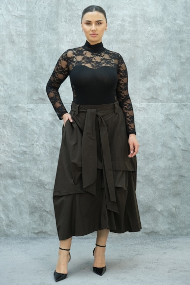  This womens skirt stands out with its elegant and modern design. It comes in a rich brown color and is available in different sizes: S, M, L, and XL. The fabric composition is 100% Polyester, offering both durability and a lightweight feel. The skirt presents a pleasing appearance from both the front and back, and the tie details add a touch of sophistication to your style.