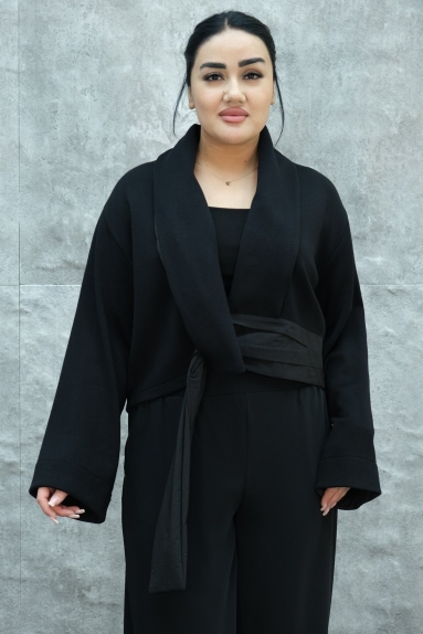  This stylish and modern womens jacket stands out with its elegant design. Its black color offers a classic look while blending with any combination. The jacket is available in sizes S, M, L, and XL. Boasting an impressive fabric composition of 80% Viscose, 15% Polyester, and 5% Elastane, it provides flexibility and durability while ensuring comfortable wear. Designed to create a sophisticated and chic silhouette with its form-fitting structure and waist tie detail, this jacket is a perfect choice for women wanting to accentuate their figure. The wide lapel and long sleeves add a touch of modernity and comfort. It can easily be worn both in daily life and special events.