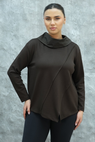  This womens blouse stands out with its elegant and modern design. Its chic brown color adds a sophisticated touch to your wardrobe. The product is made from 90% viscose and 10% elastane, providing a soft and flexible structure for comfort. With its thin fabric and long-sleeved design, it is suitable for all seasons. The asymmetric details on the front and the buttoned design on the back add a graceful touch to the blouse. Available in sizes L and XL.
