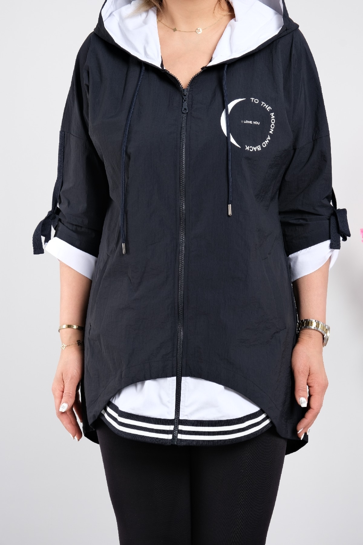 Stylish women's trench coat for plus sizes with a hood with a zipper and pockets