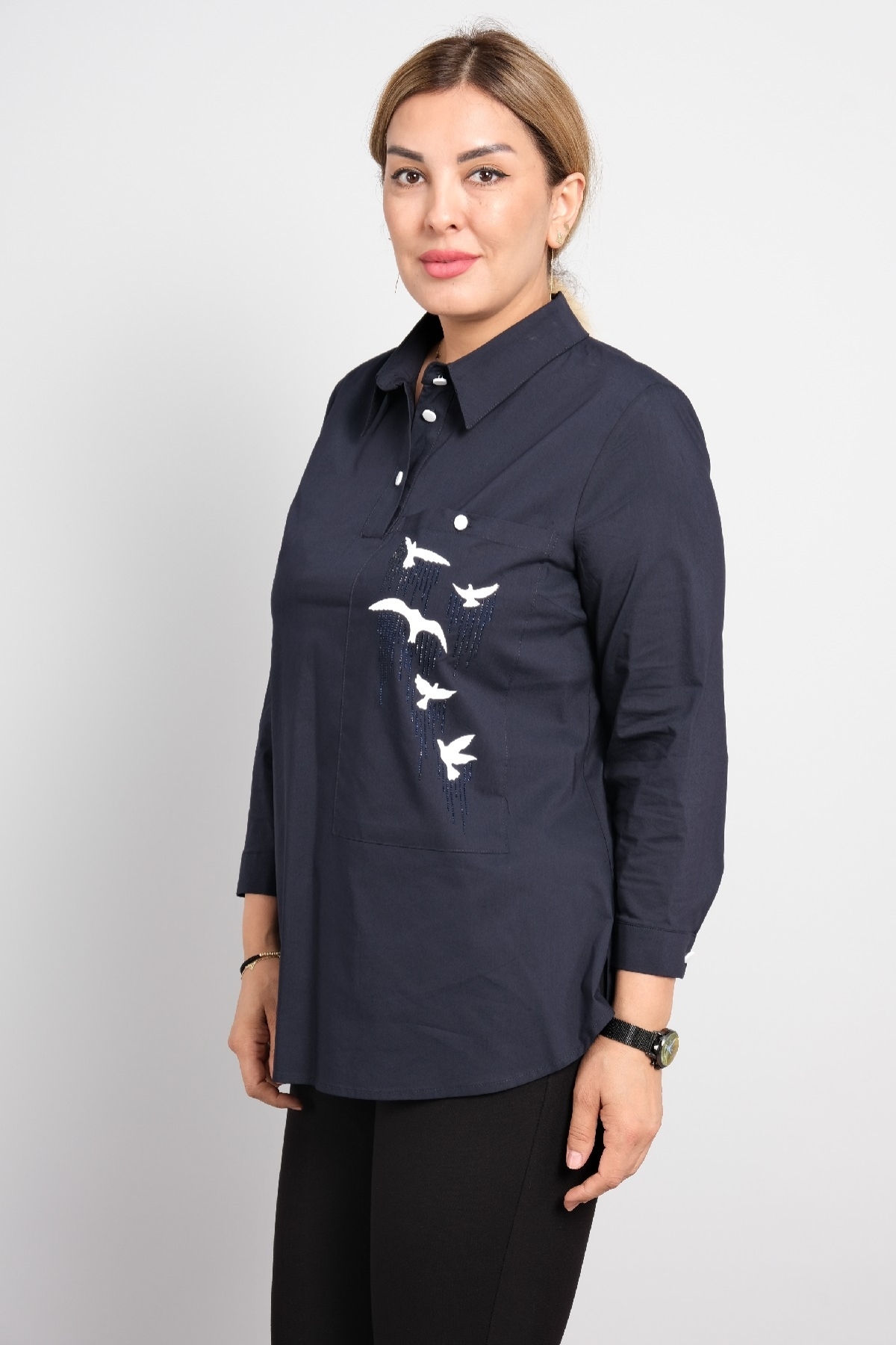 Womens polo shirt with long sleeves in big sizes. Stylish sports shirt with bird print.