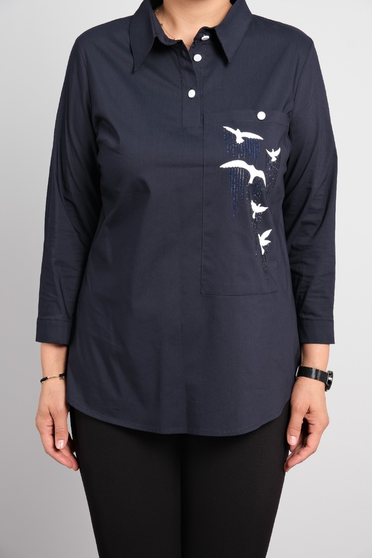 Womens polo shirt with long sleeves in big sizes. Stylish sports shirt with bird print.
