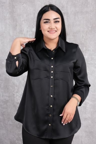  This product is a plus-size womens blouse in black. The available sizes are 44, 46, 48, and 50. The fabric composition is 65% Cotton, 30% Polyester, and 5% Elastane. This blend of materials provides a comfortable wearing experience while allowing the skin to breathe. The blouse features button details on the front and stylish buttons on the cuffs. Its loose fit comfortably covers body contours, making it extremely suitable for everyday use.
