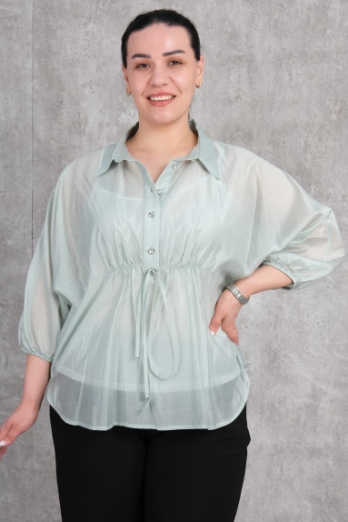  This product is an elegantly designed blouse specifically for plus size women. It stands out with its stunning petrol green color and is available in sizes 42, 44, 46, and 48. Made from high-quality fabric with 65% Cotton, 30% Polyester, and 5% Elastane, it ensures a comfortable wearing experience. The blouse features button details on the front and a waist-tie detail for added elegance. Its lightweight and breathable structure provide comfort even in hot weather. With its wide sleeves and semi-transparent design, it offers both a chic and comfortable look.