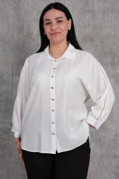  This plus-size womens shirt stands out with its elegant white color and stylish design. The shirt comes in sizes 42, 44, 46, and 48, offering a fit for every body type. The high-quality fabric content consists of 65% cotton, 30% polyester, and 5% elastane, providing comfort and flexibility. The shirt has a button-down front, long sleeves with elegant details, and a plain, simple back view. This classic yet modern shirt is suitable for daily wear as well as for enhancing your elegance on special occasions.