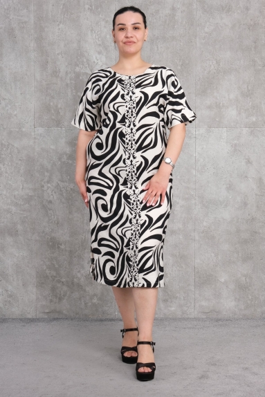  This product is a Plus Size womens dress and, as seen on the model, is in black color. The dress is available in sizes 42, 44, 46, and 48. The fabric content is 100% Viscose. The front part of the dress features black and white patterns and a delicate design detail running down the middle. The backside of the dress showcases an elegant bow detail at the nape of the neck.