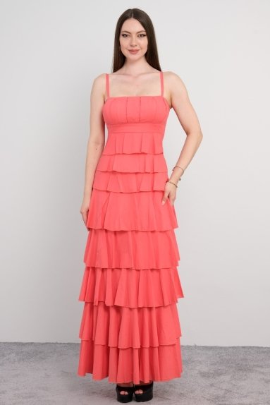  This elegant dress is worn by a small size STELLA female model and comes in a vibrant coral color. Available in sizes 36, 38, 40, and 42, it is made entirely of 100% cotton, making it both lightweight and breathable. The dress is presented with both front and back views. The front features a sleek design with straps, and the skirt portion is tiered, adding a touch of elegance.