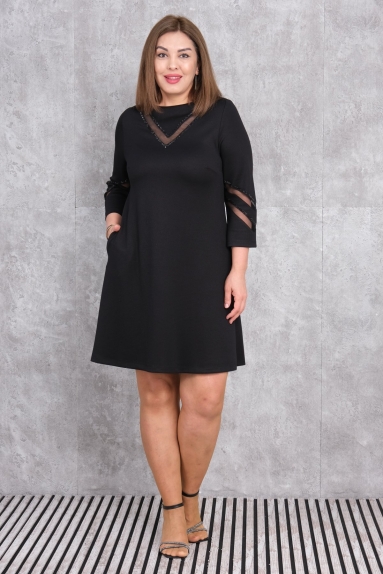  This elegant black dress is specially designed for plus-size women. It is available in sizes 42, 44, 46, and 48. The fabric content comprises 75% Polyester, 20% Cotton, and 5% Lycra, making it stretchy and comfortable. The dress features details on the front and sleeves, with a 3/4 sleeve length and knee-length hem. Its perfect for both casual and special occasions.