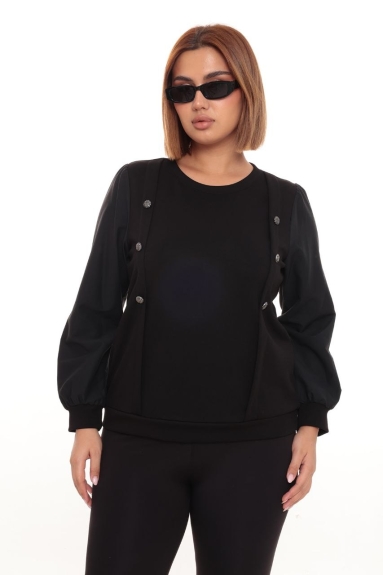  This plus-size black blouse is a stylish and comfortable option. As seen on the model, it features decorative buttons on the front and long sleeves with elastic cuffs. The blouse is made of 47% Viscose, 47% Polyester, and 6% Lycra. This fabric combination ensures the blouse is both comfortable and durable. Available sizes include 42, 44, 46, and 48. Its black color makes it suitable for any combination, perfect for everyday wear or special occasions.