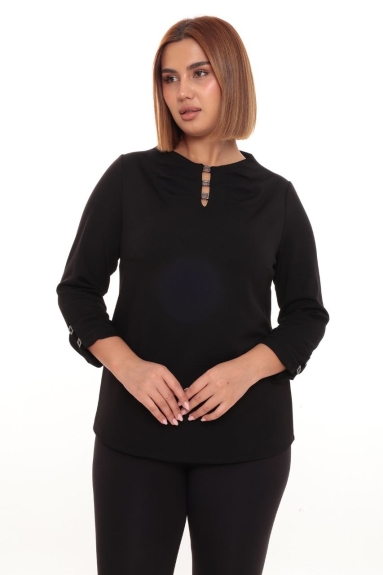  This elegant and modern blouse is designed for plus-size women. It comes in black and is made from a fabric blend of 47% Viscose, 47% Polyester, and 6% Lycra. The comfortable and stretchy fabric ensures all-day ease. The decorative details at the front and button embellishments on the sleeves add a chic touch to its simple design. Available in sizes 42, 44, 46, and 48, this blouse is perfect for both casual wear and special occasions.